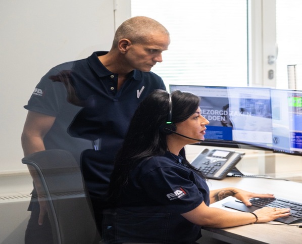 Two people working in an office.